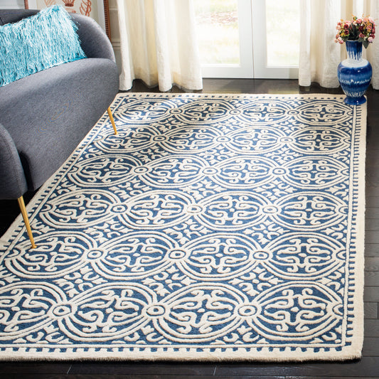 Safavieh Cambridge 6 x 9 (ft) Tufted Wool Navy Blue/Ivory Rectangular Indoor Mid-Century Modern Professionally Clean Only Area rug