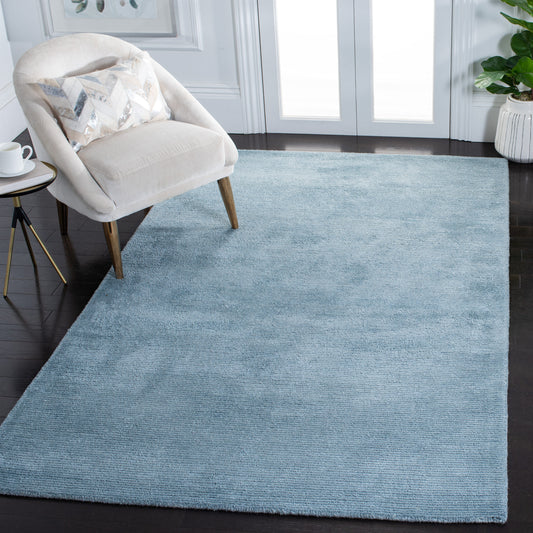 Safavieh Himalaya 6 x 9 (ft) Tufted Wool Blue Rectangular Indoor Solid Professionally Clean Only Area rug
